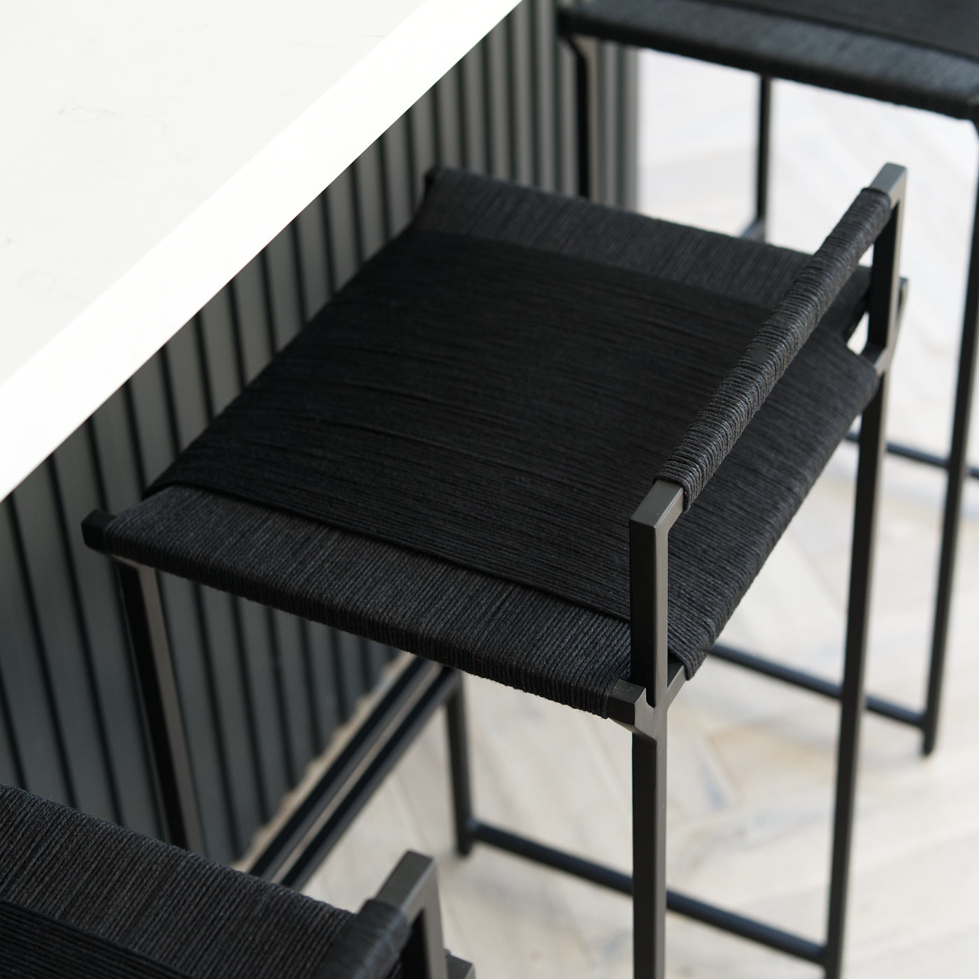 Black woven counter stool