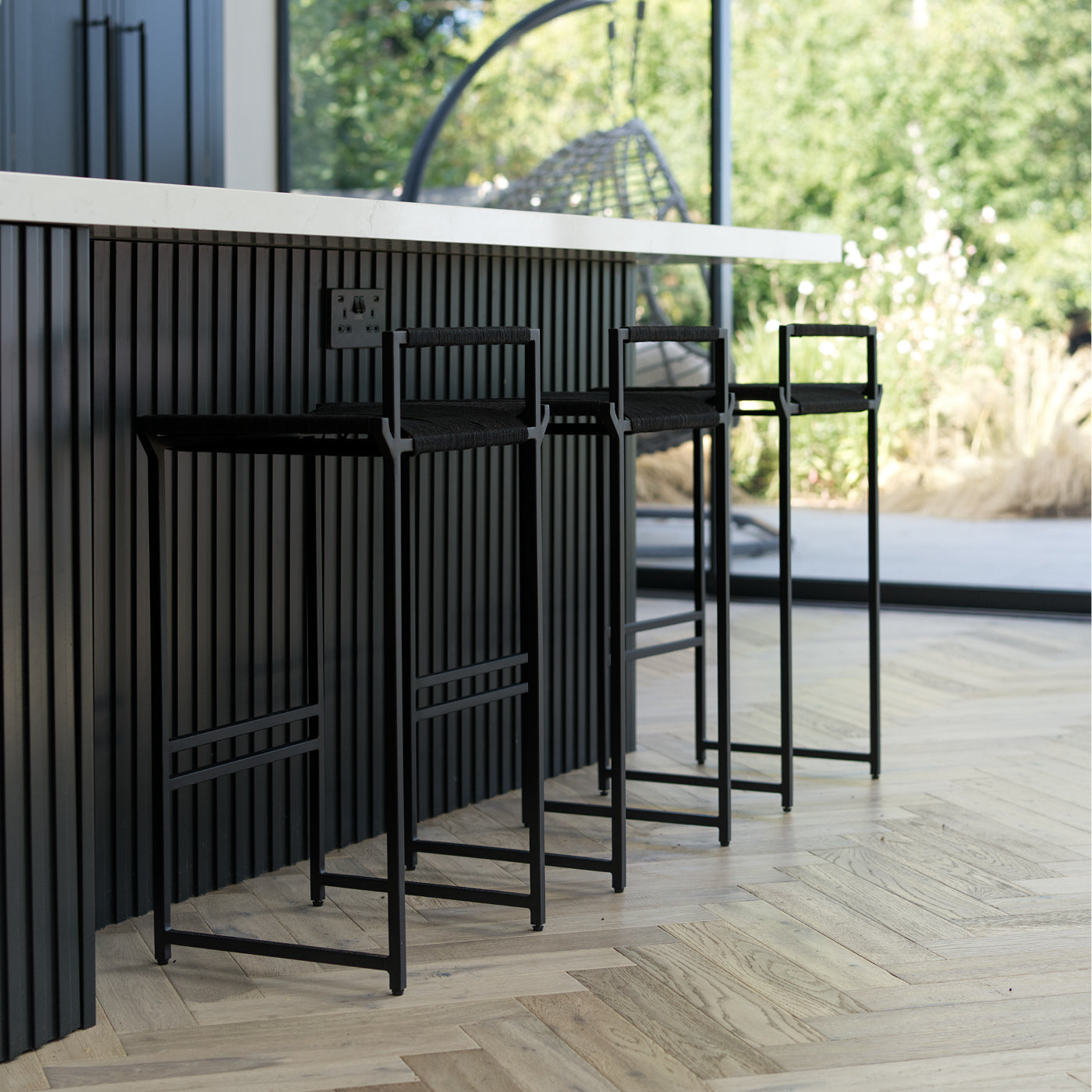 Black woven bar stool