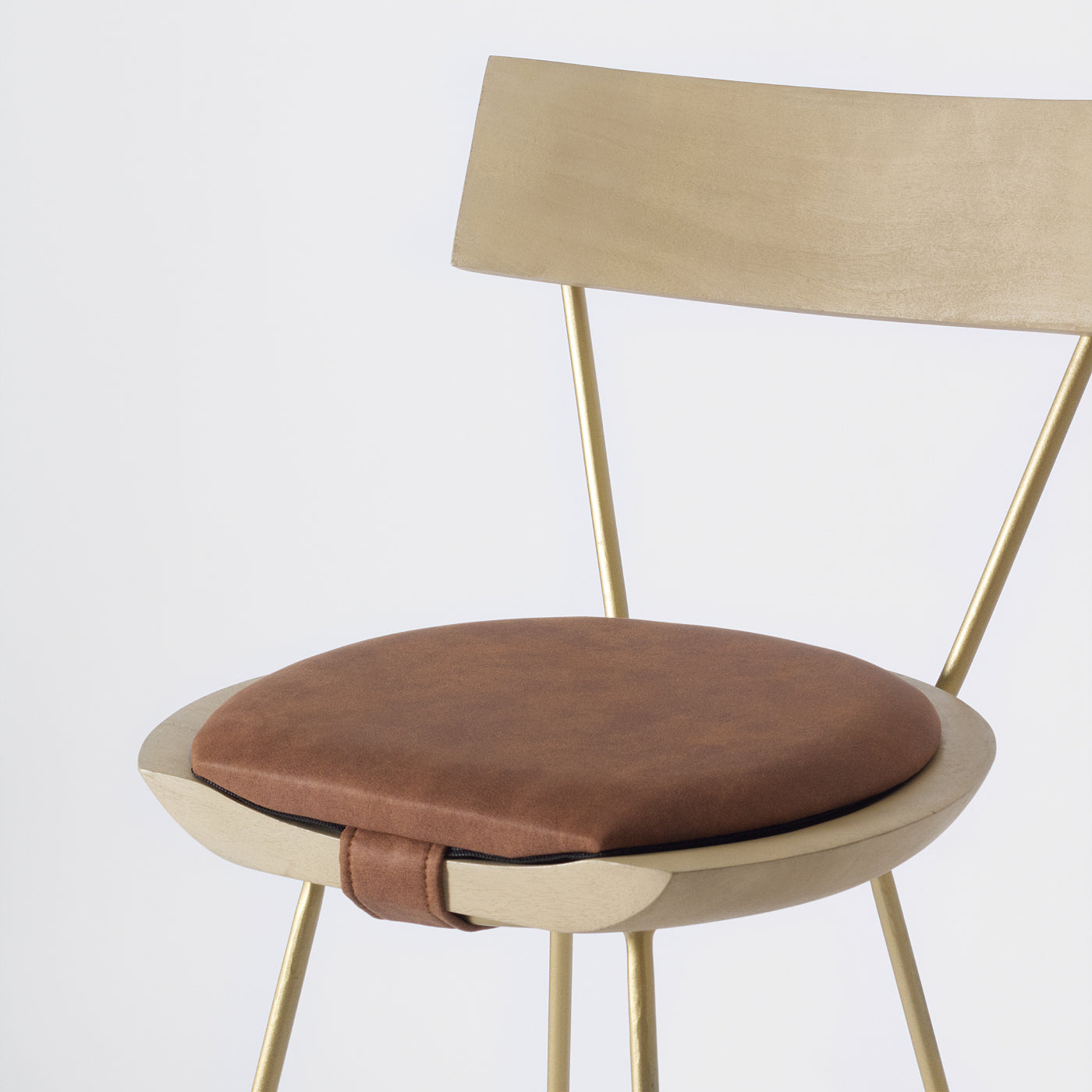 Dark leather and gold stool