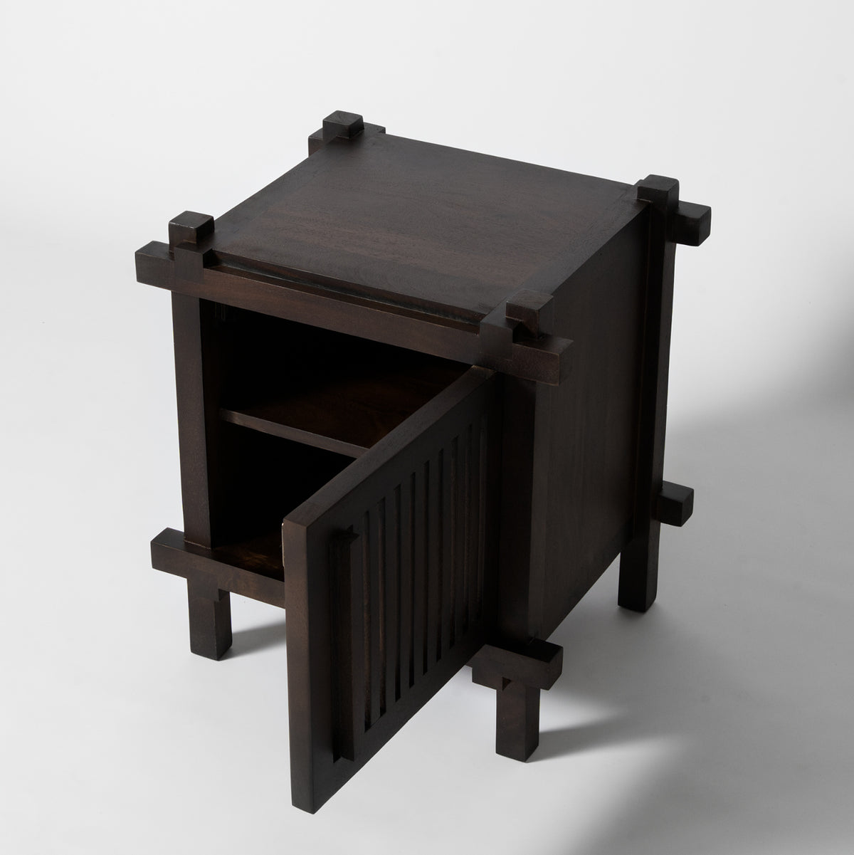 Dark wood bedside table