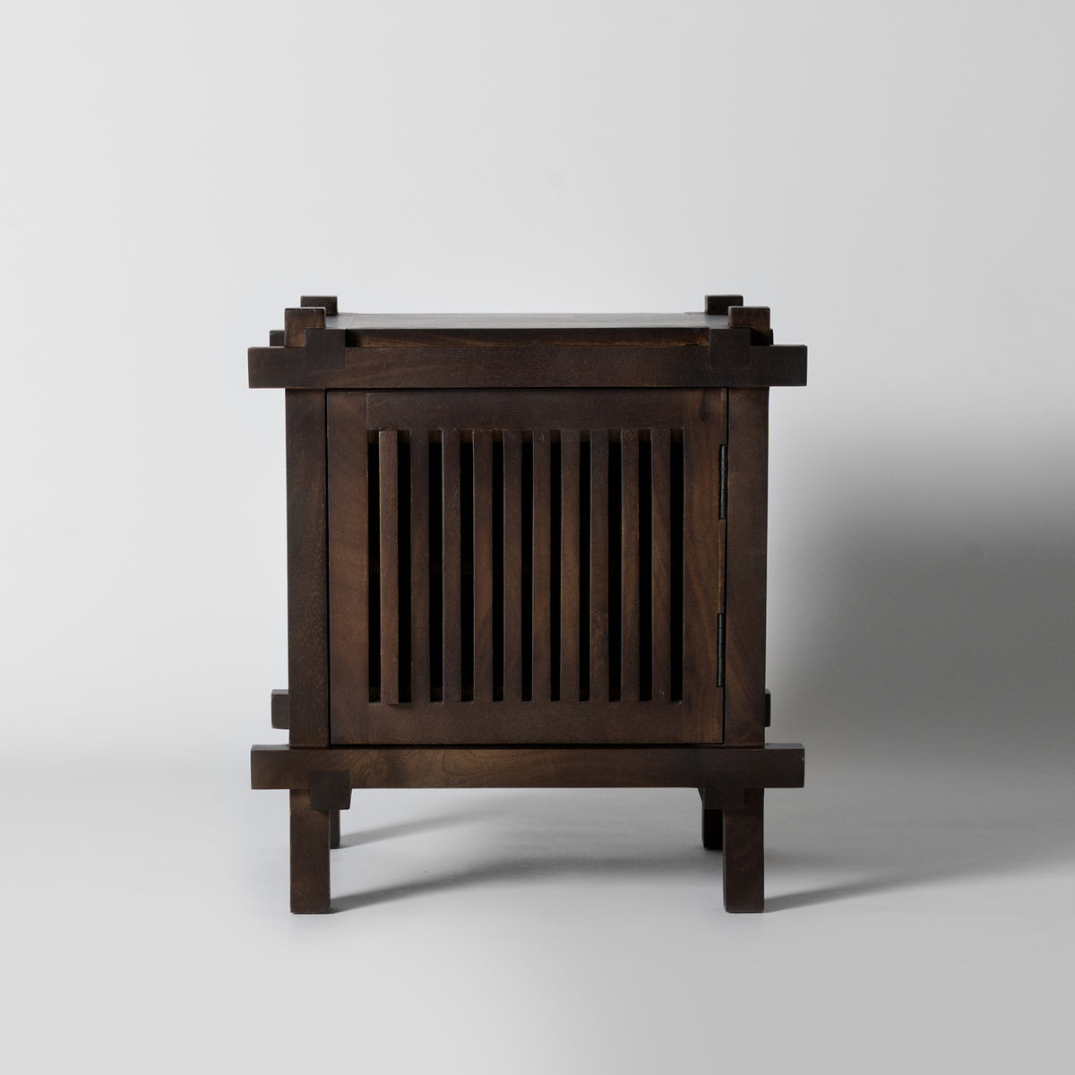 Slatted dark wood bedside table