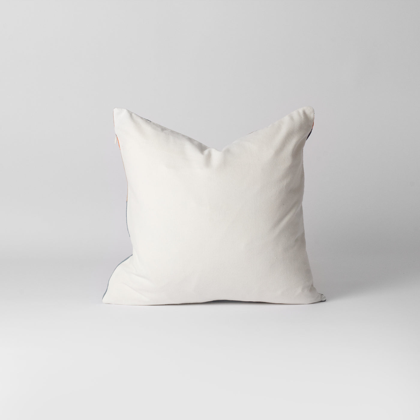 orange and white geometric cushion