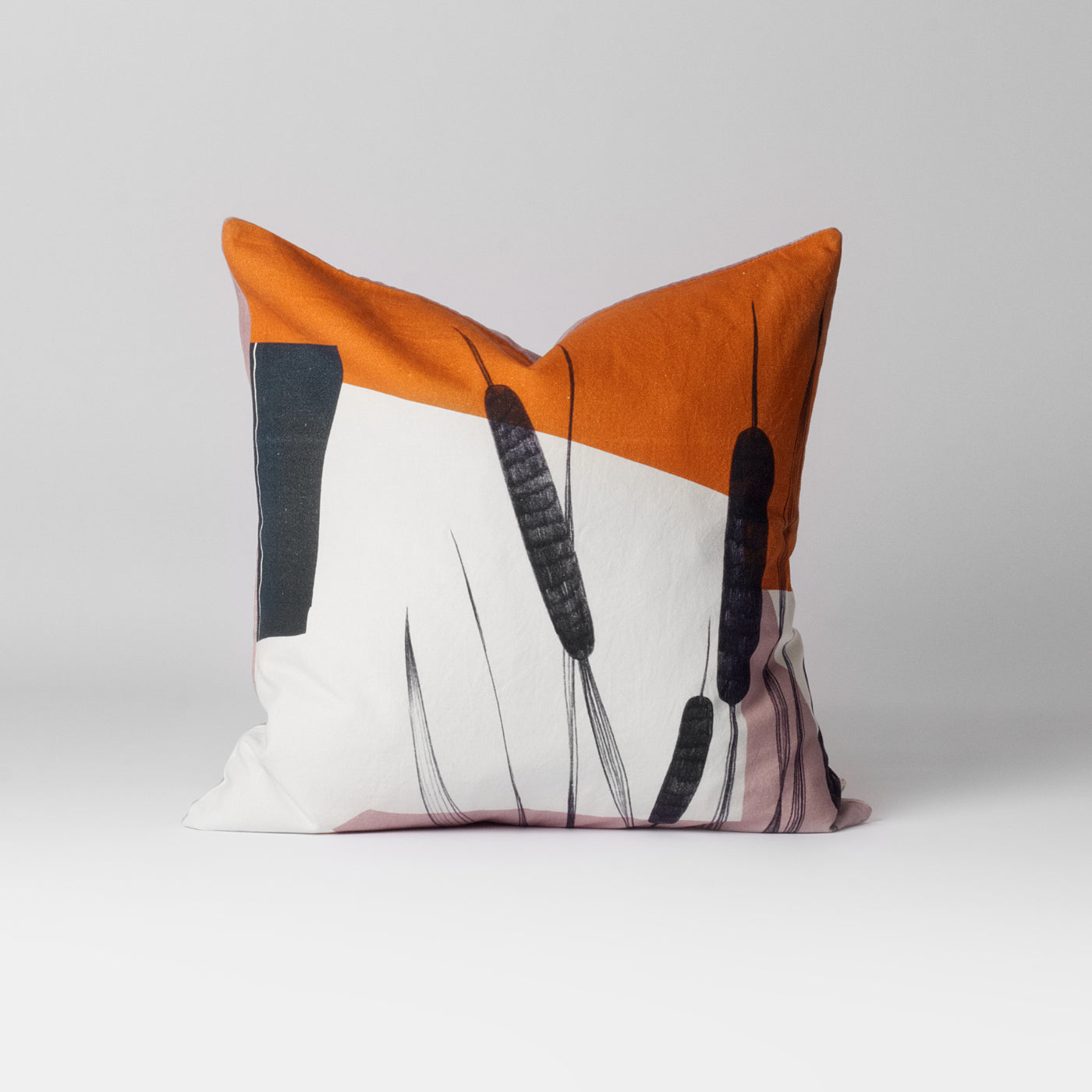 orange and white printed cushion