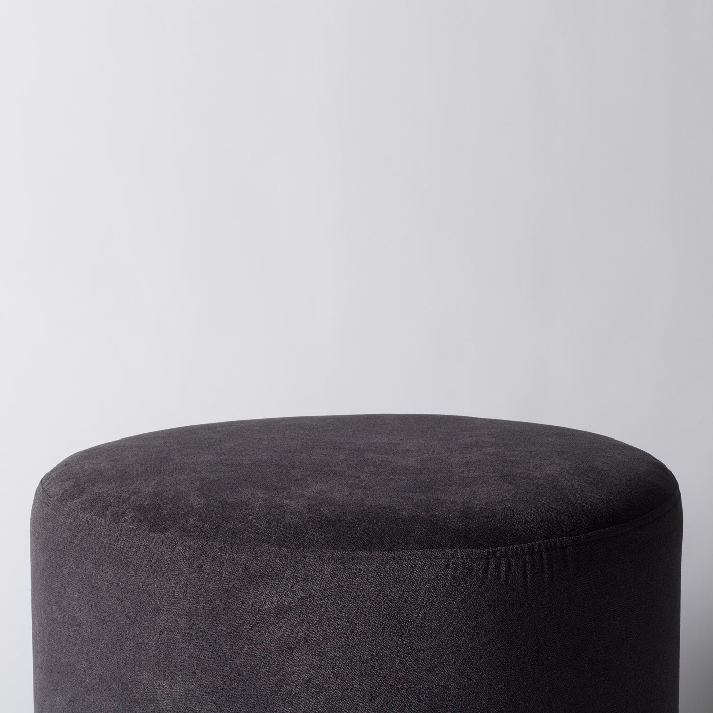 Round grey pouffe