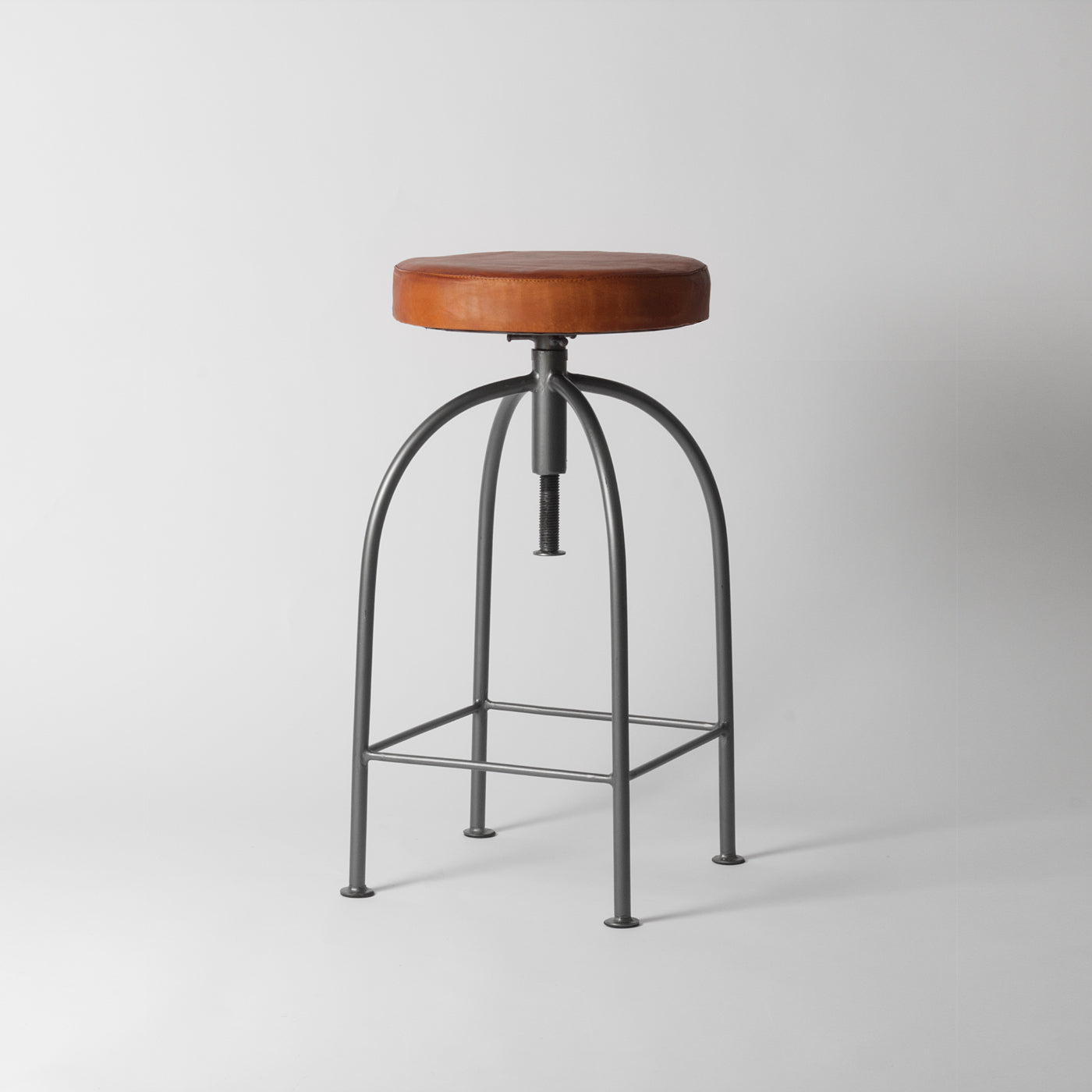 Tan leather adjustable bar stool