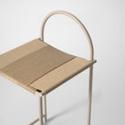 Beige metal counter stool with handwoven rope seat