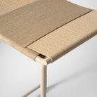 Arched back bar stool in matte beige