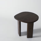 Wooden side table with a dark finish