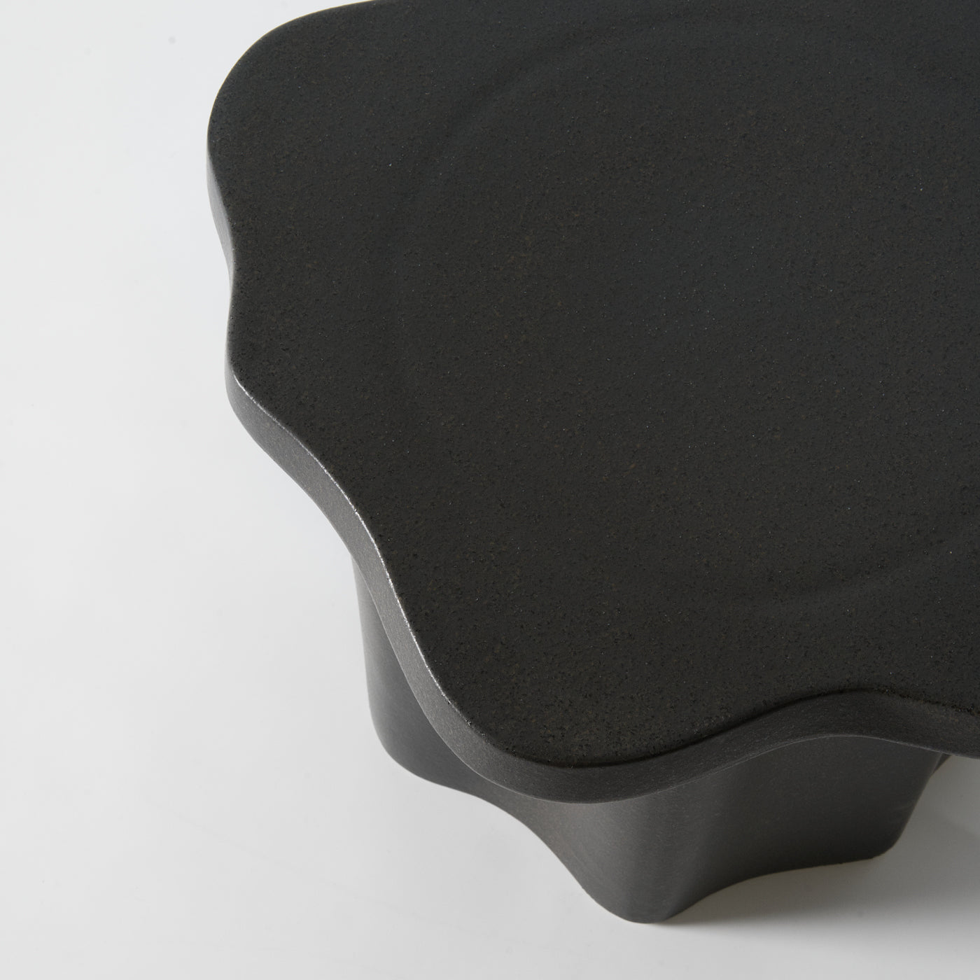 Organic shaped stoneware sidetable