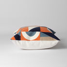 orange and white patterned cushion